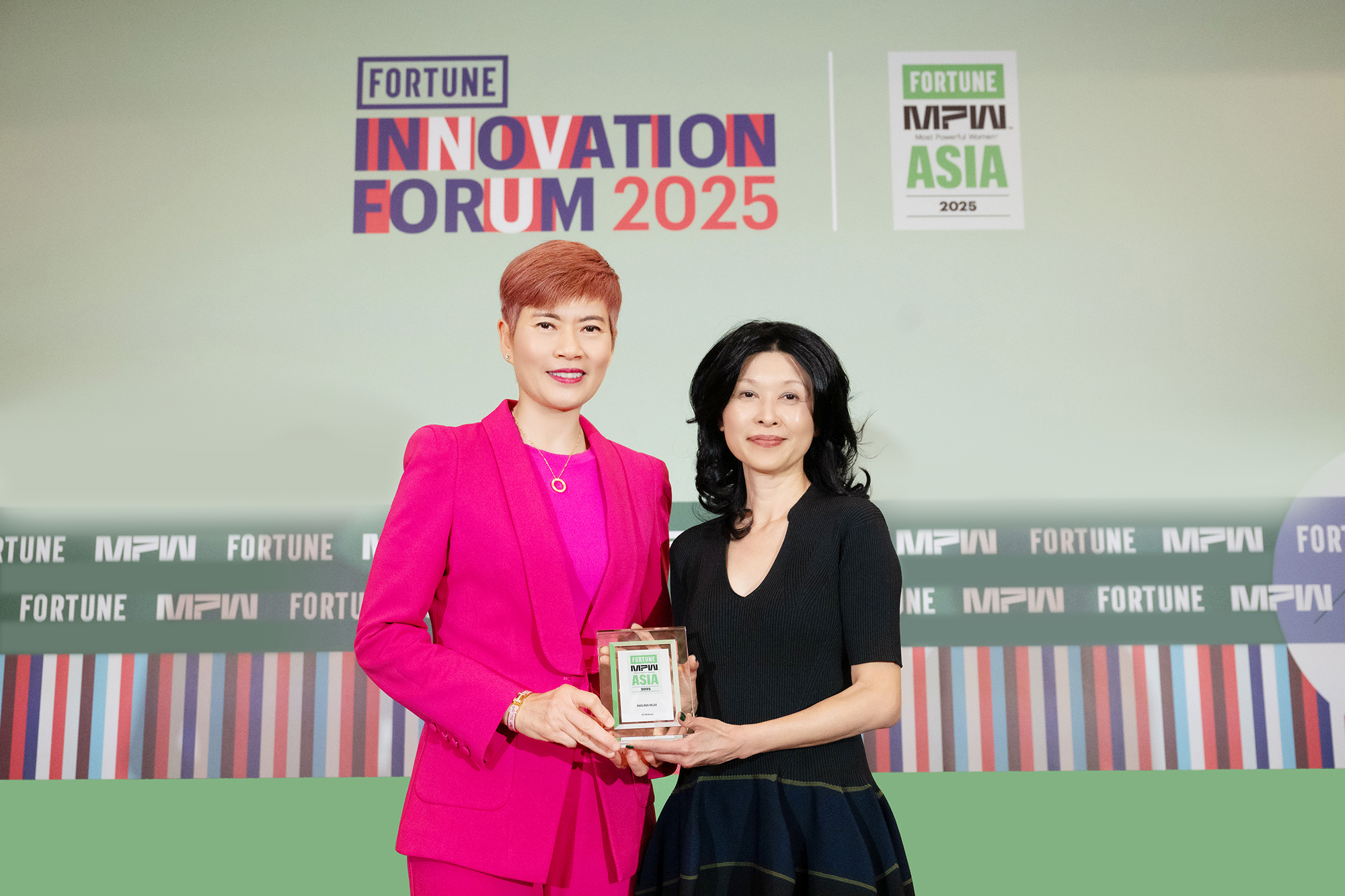 Khoon Fong Ang, Asia CEO of Fortune (right) presents the Fortune's The Most Powerful Women 2025 honour to Dr. Malina Ngai, Group CEO of AS Watson, in recognition of her outstanding leadership and influence in the retail industry.