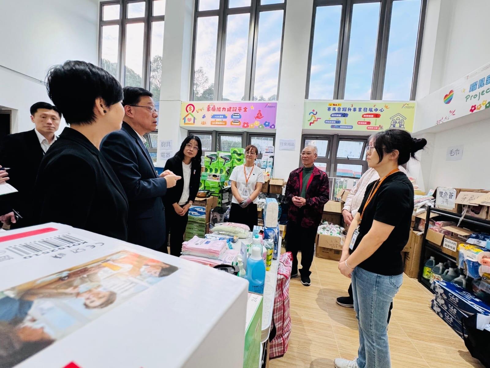 HKSAR’s Chief Executive John Lee (third left) visits affected residents being accommodated in transitional housing