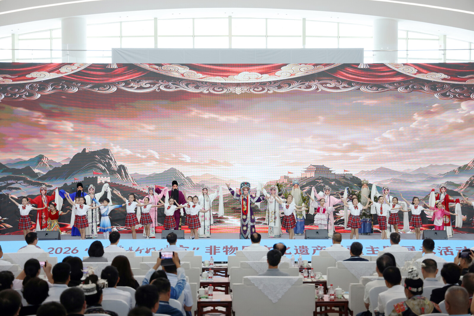 On July 30, the 2026 "Xinjiang, A Land of Wonders" themed exhibition supporting Xinjiang through intangible cultural heritage opened in Shihezi City, Xinjiang. Pictured is a traditional Chinese opera performance at the opening ceremony.