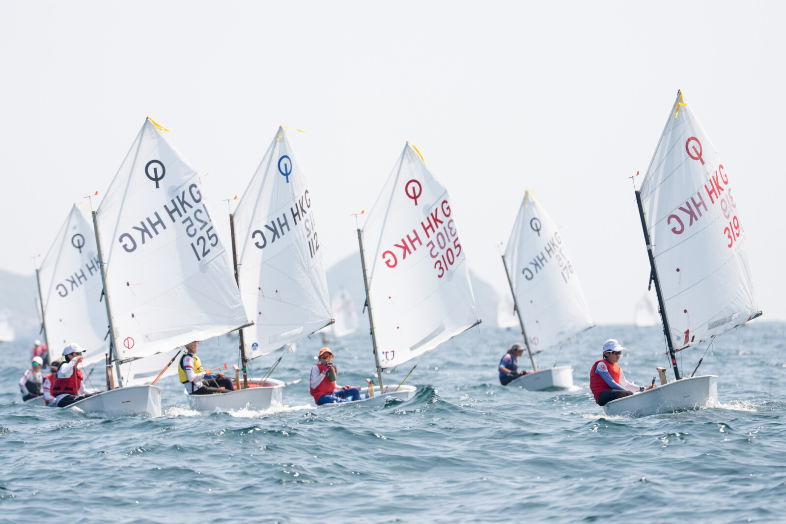Young sailors competing in the Optimist Class.